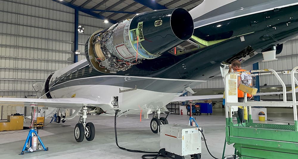 Two aircraft inside a hangar